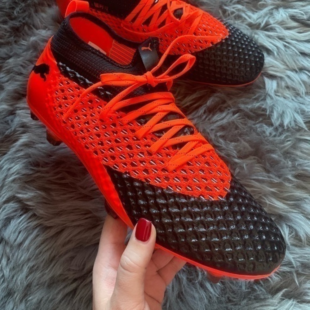 Puma black/orange future cleats
